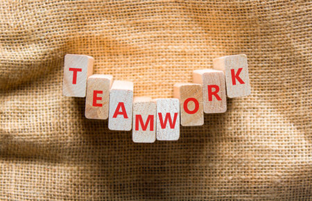 Teamwork word symbol. Concept word Teamwork on beautiful wooden blocks. Beautiful canvas background....