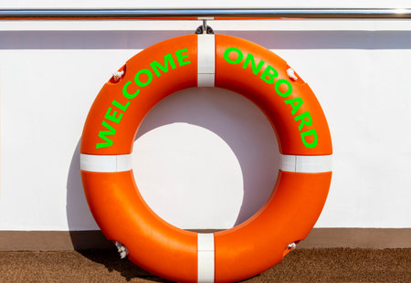 Welcome onboard symbol. Concept words Welcome onboard on beautiful orange lifebuoy. Beautiful white...