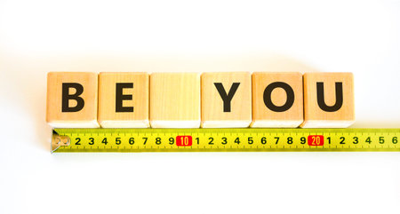 Be you support and help symbol. Concept word Be you on beautiful wooden blocks. Beautiful white...