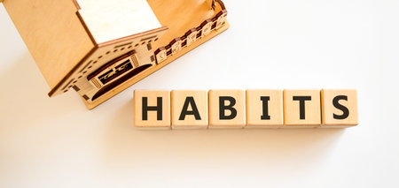 Habits support and help symbol. Concept word Habits on beautiful wooden blocks. Beautiful white...