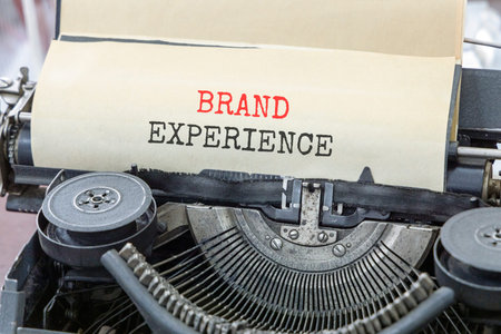 Brand experience symbol. Concept words Brand experience typed on beautiful old retro typewriter....
