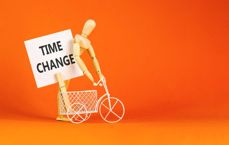 Time change symbol. Concept word Time change on beautiful white paper. Beautiful wooden clothespin....