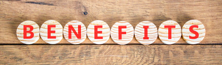 Benefits word symbol. Concept word Benefits on beautiful wooden circles. Beautiful wooden...
