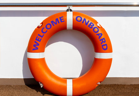 Welcome onboard symbol. Concept words Welcome onboard on beautiful orange lifebuoy. Beautiful white...