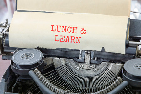 Lunch and learn symbol. Concept words Lunch and learn typed on beautiful old retro typewriter....