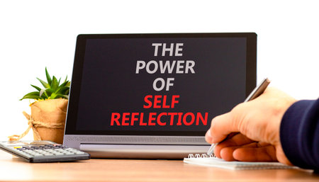 Self reflection symbol. Concept words Success begins with self reflection on beautiful tablet's screen. Beautiful white background. Business success begins with self reflection concept. Copy space.の写真素材