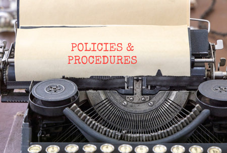 Policies and procedures symbol. Concept words Policies and procedures typed on beautiful old retro...