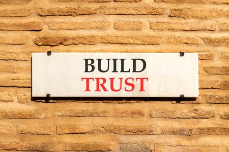 Build trust symbol. Concept words Build trust on beautiful big white sign plate. Beautiful old brown...