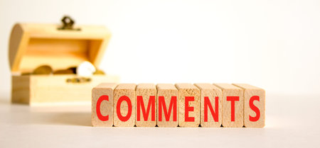 Comments comment word symbol. Concept word Comments on beautiful wooden blocks. Beautiful white...