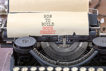 How to build good credit symbol. Concept words How to build good credit typed on old retro...