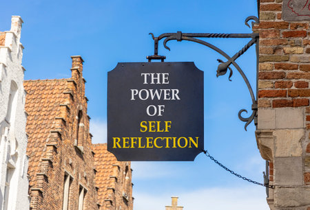 Self reflection symbol. Concept words The power of self reflection on beautiful black road sign....