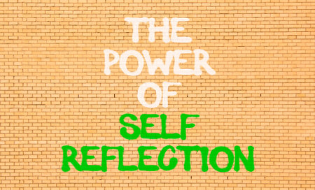 Self reflection symbol. Concept words The power of self reflection on beautiful brick wall....