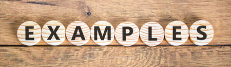 Example examples symbol. Concept word Examples on beautiful wooden circles. Beautiful wooden...