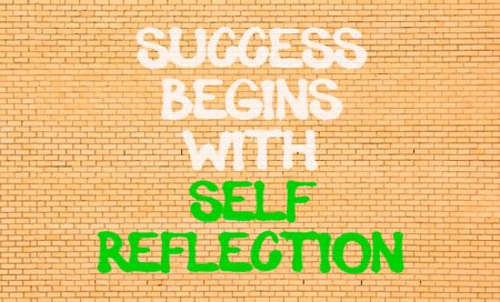 Self reflection symbol. Concept words Success begins with self reflection on beautiful brick wall. Beautiful brick wall background. Business success begins with self reflection concept. Copy space.の写真素材