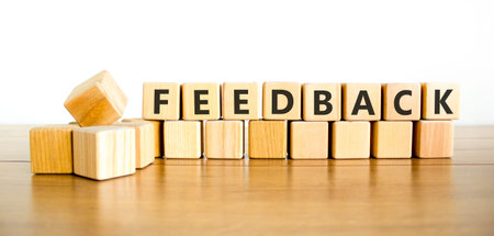 Feedback word symbol. Concept word Feedback on beautiful wooden blocks. Beautiful wooden table white background. Business support help feedback word concept. Copy space.の写真素材
