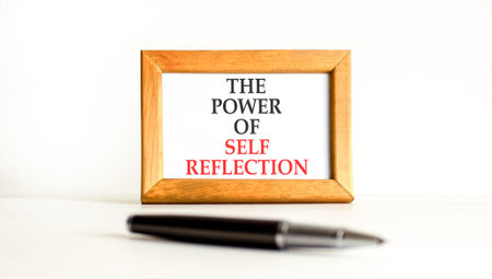 Self reflection symbol. Concept words The power of self reflection on beautiful wooden picture...