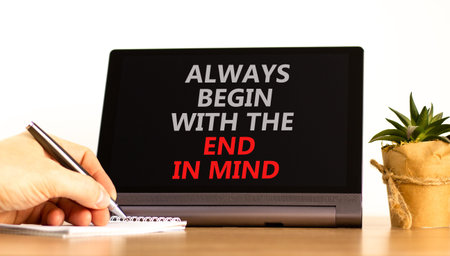 Begin with the end in mind symbol. Concept words Always begin with the end in mind on beautiful tablet's screen. Beautiful white background. Business begin with the end in mind concept. Copy space.の写真素材