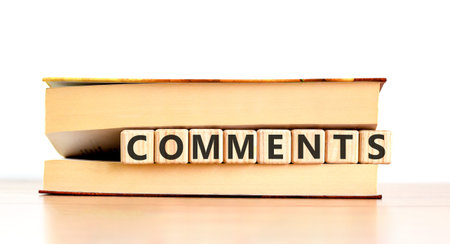 Comments comment word symbol. Concept word Comments on beautiful wooden blocks in book. Beautiful...
