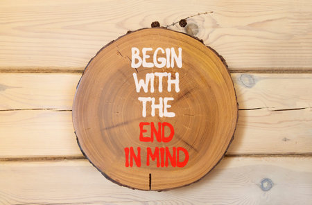Begin with the end in mind symbol. Concept words Begin with the end in mind on beautiful wooden...