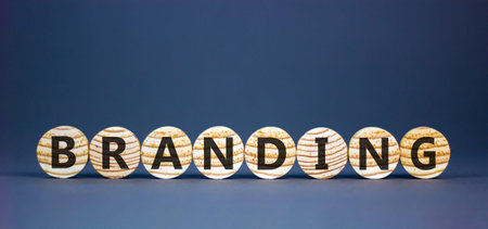 Branding brand word symbol. Concept word Branding on beautiful wooden circles. Beautiful grey...