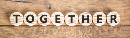 Together word symbol. Concept word Together on beautiful wooden circles. Beautiful wooden...