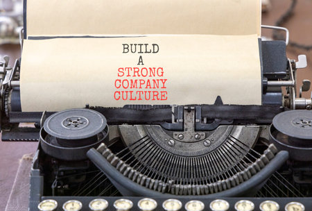 Strong company culture symbol. Concept words Build a strong company culture typed on old retro...