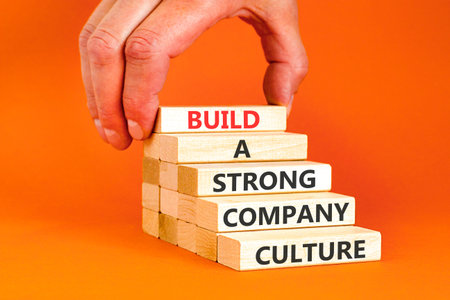 Strong company culture symbol. Concept words Build a strong company culture on beautiful wooden...