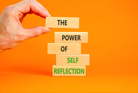 Self reflection symbol. Concept words The power of self reflection on beautiful wooden blocks....