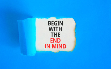 Begin with the end in mind symbol. Concept words Begin with the end in mind on beautiful white paper. Beautiful blue paper background. Business begin with the end in mind concept. Copy space.の写真素材