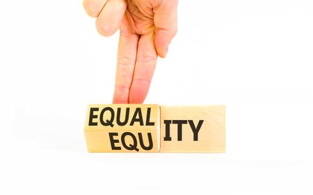 Equity and equality symbol. Concept words Equality to Equity on beautiful wooden cubes. Beautiful...