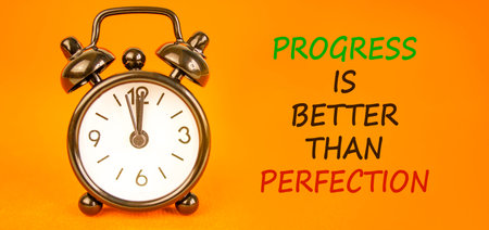 Progress or perfection words symbol. Concept words Progress is better than perfection on beautiful...