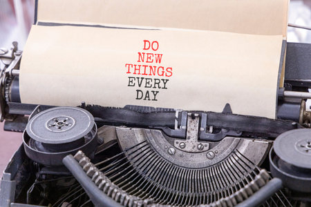 Do new things every day words symbol. Concept words Do new things every day typed on old retro...