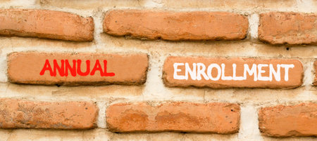 Annual enrollment words symbol. Concept words Annual enrollment on beautiful brick wall. Beautiful...