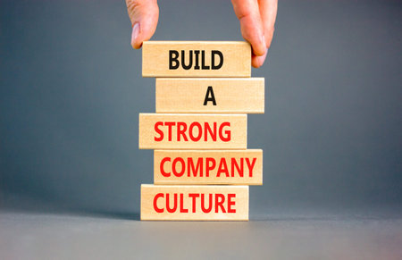 Strong company culture symbol. Concept words Build a strong company culture on beautiful wooden...