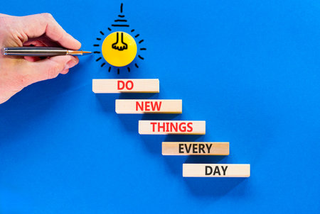 Do new things every day words symbol. Concept words Do new things every day on beautiful wooden...