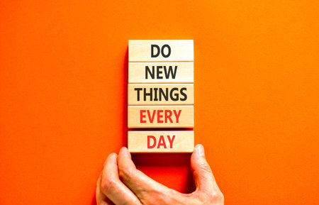 Do new things every day words symbol. Concept words Do new things every day on beautiful wooden...
