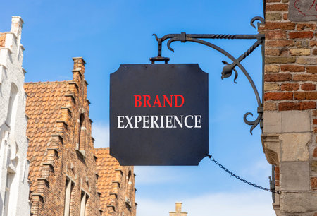 Brand experience symbol. Concept words Brand experience on beautiful black road sign. Beautiful blue...