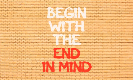 Begin with the end in mind symbol. Concept words Begin with the end in mind on beautiful brick wall....