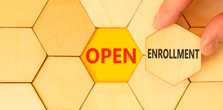 Open enrollment words symbol. Concept words Open enrollment on beautiful wooden puzzles. Beautiful...