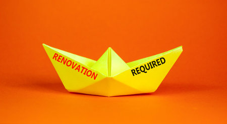Renovation required words symbol. Concept words Renovation required on beautiful yellow paper boat....