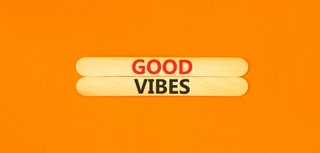 Good vibes words symbol. Concept words Good vibes on beautiful wooden sticks. Beautiful orange...