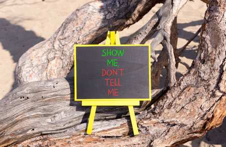 Tell or show symbol. Concept words Show me, do not tell me on beautiful black blackboard. Beautiful...