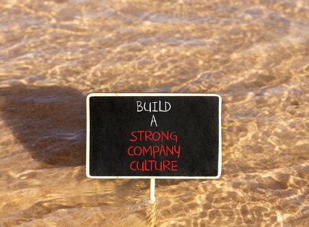 Strong company culture symbol. Concept words Build a strong company culture on beautiful black...