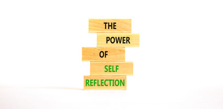 Self reflection symbol. Concept words The power of self reflection on beautiful wooden blocks. Beautiful white paper background. Business the power of self reflection concept. Copy space.の写真素材