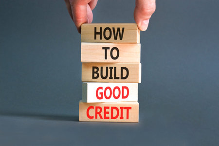 How to build good credit symbol. Concept words How to build good credit on beautiful wooden blocks....