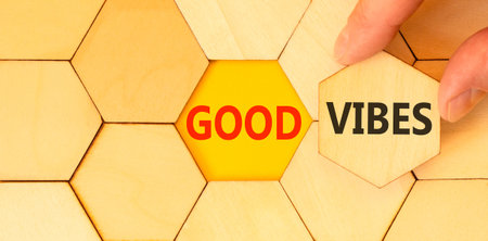 Good vibes words symbol. Concept words Good vibes on beautiful wooden puzzles. Beautiful yellow...