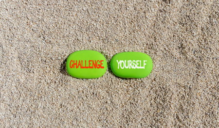 Challenge yourself words symbol. Concept words Challenge yourself on beautiful green stones....