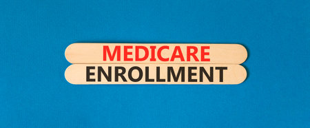 Medicare enrollment words symbol. Concept words Medicare enrollment on beautiful wooden sticks....