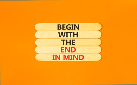 Begin with the end in mind symbol. Concept words Begin with the end in mind on beautiful wooden sticks. Beautiful orange paper background. Business begin with the end in mind concept. Copy space.の写真素材