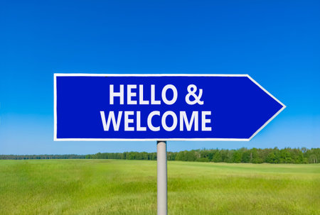 Hello and welcome symbol. Concept words Hello and welcome on beautiful blue road sign. Beautiful...